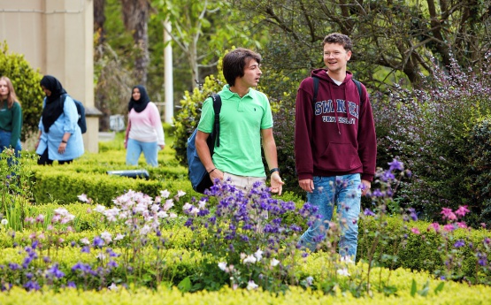 Two students walking on Singleton Campus