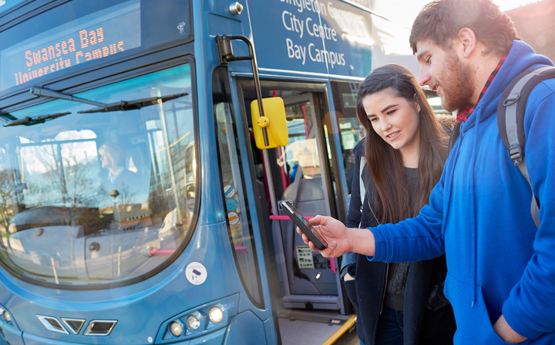 Two students getting on a bus