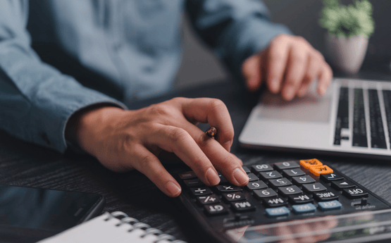 Man using calculator. 