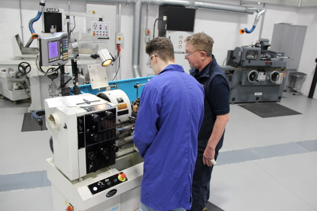 Student and lecturer working in lab