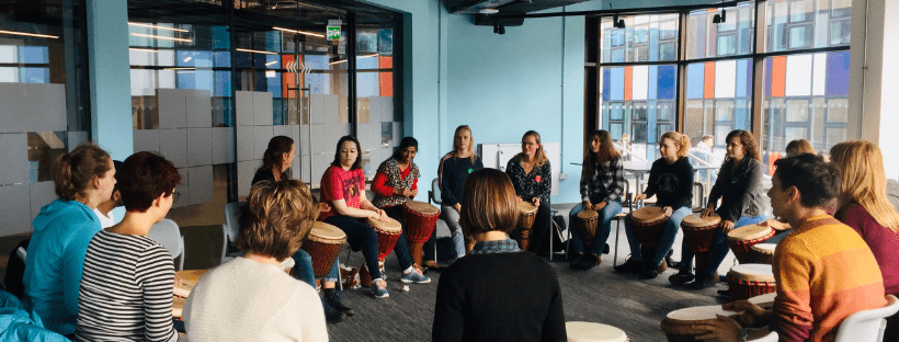 students drumming, Zumba, welcome talk