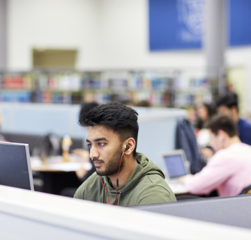 male student in library