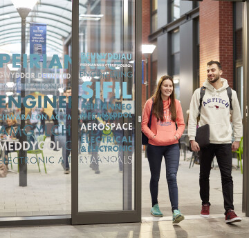 Students walking through bay campus 