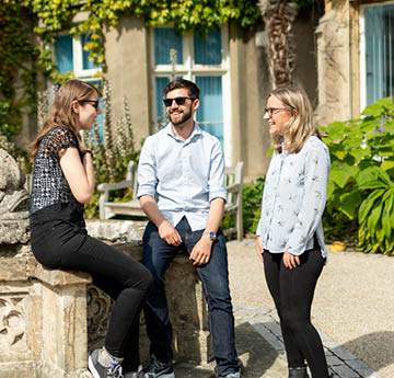 students speaking together outside