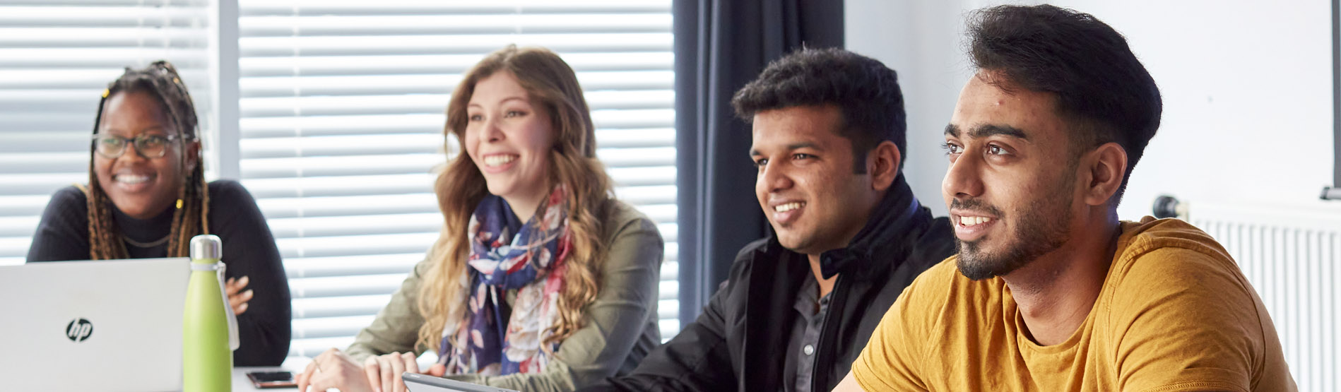 Students sitting behind desk