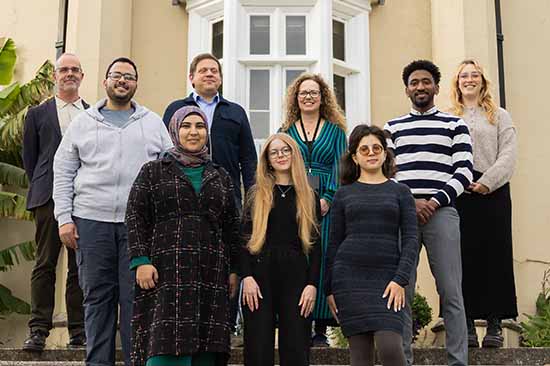 Representatives from Swansea University with international students displaced from their homes
