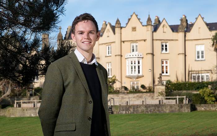 Sam Blaxland outside Swansea University's Singleton Abbey