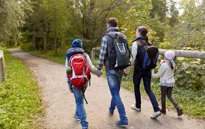 A family going for a walk outdoors.