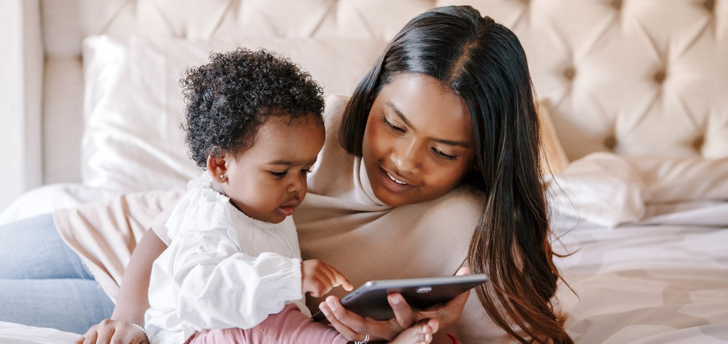 A toddler and mum using an iPad 