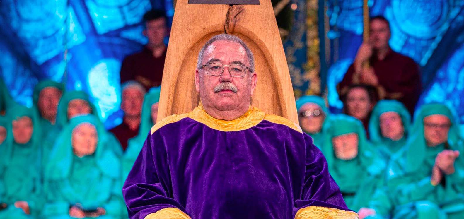 Professor Alan Llwyd being chaired on the Eisteddfod stage