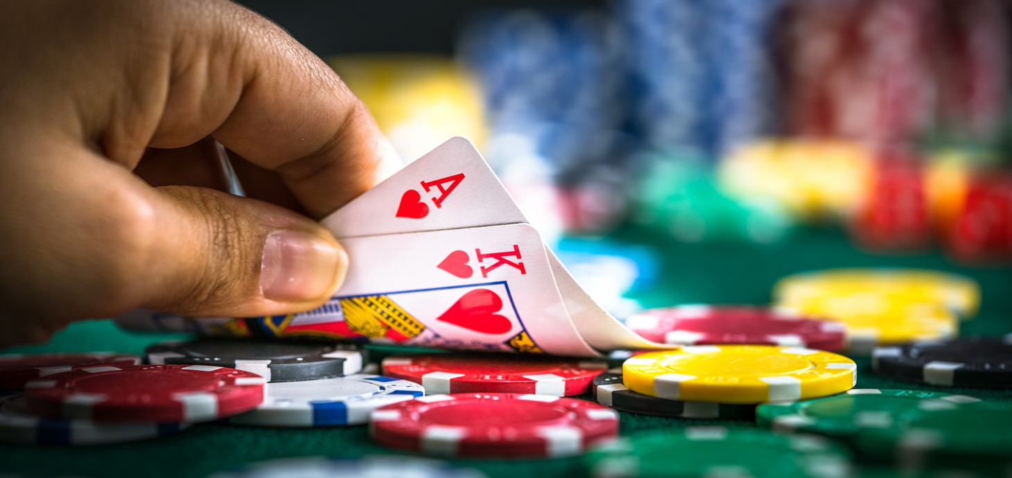 A close up of a person playing a card game. Credit: iStock.com/okan akdeniz