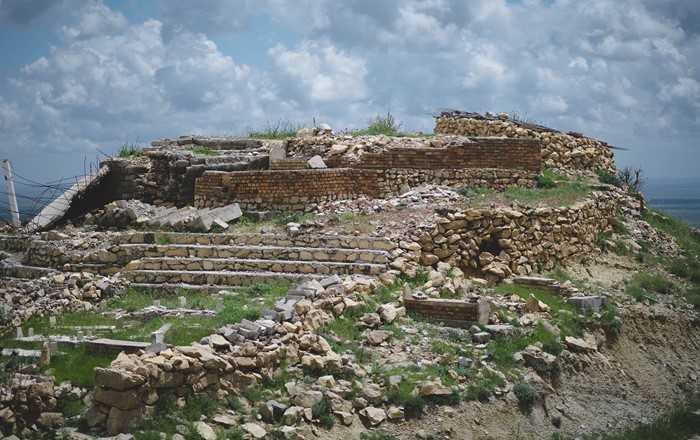 Yazidi shrine of Mame Reshan in Shingal, Iraq, after its destruction by Islamic State, credit: Levi Clancy. Cultural heritage such as sacred sites is crucial for the identity and mental health of displaced peoples. 