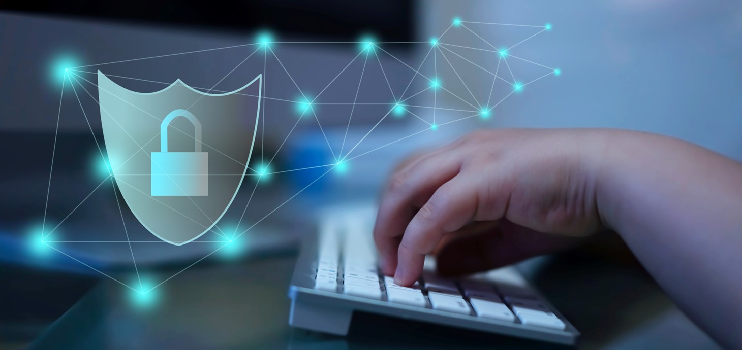 Child's hands using keyboard with graphic of padlock