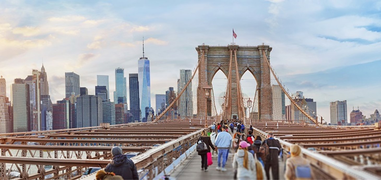 People crossing the Brooklyn Bridge, New York. Corrosion of metal is estimated to cost around $2.2 trillion, more than 3% of global GDP. It can also cost lives. Any product that includes metal - buildings, bridges, cars, aeroplanes – becomes weaker and less safe if corrosion takes hold.