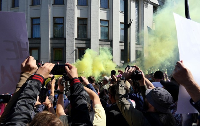 People filming a protest on mobile phones: open-source image, audio and video footage has huge potential for human rights investigations. The OSR 4 Rights project has helped courts assess this evidence more effectively