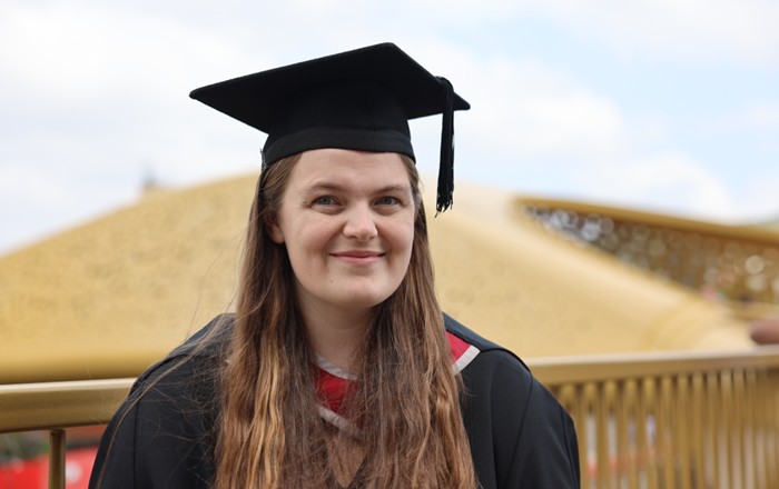 Karen Armitage in her graduation cap and gown.