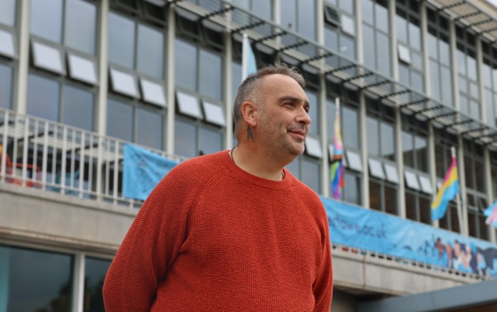 Mark standing outside Swansea University's Fulton House.