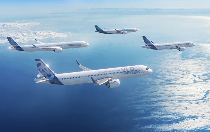 Four Airbus aircraft in flight, including an A220-300, A321XLR, A330-900 and A350-1000. Credit: Airbus SAS 2024.