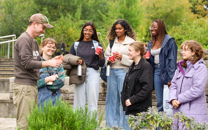 Group of people standing around in a garden