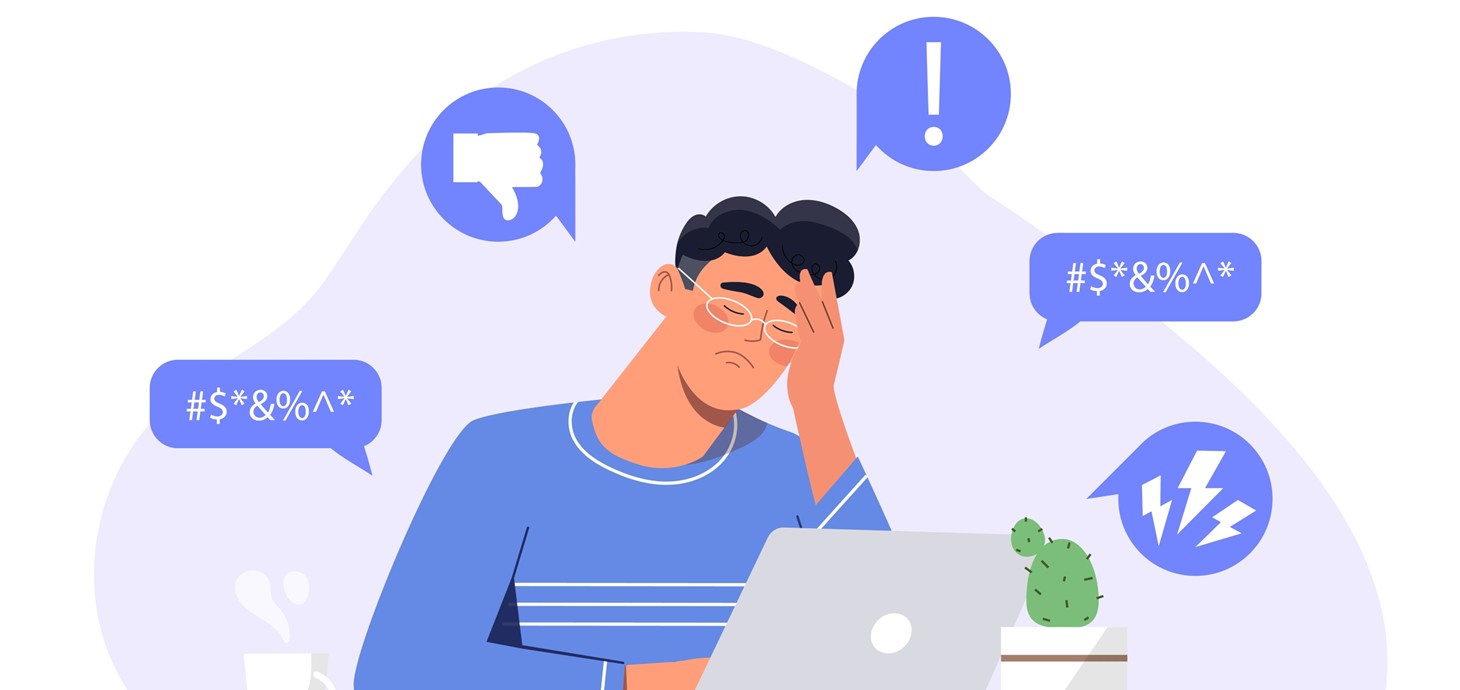 Illustration of a frustrated person sitting at a desk with a laptop, surrounded by negative speech bubbles