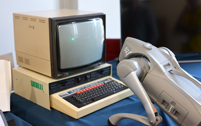A photo showing the BBC Microcomputer System (left) and the Unitree Go2 robot (right).