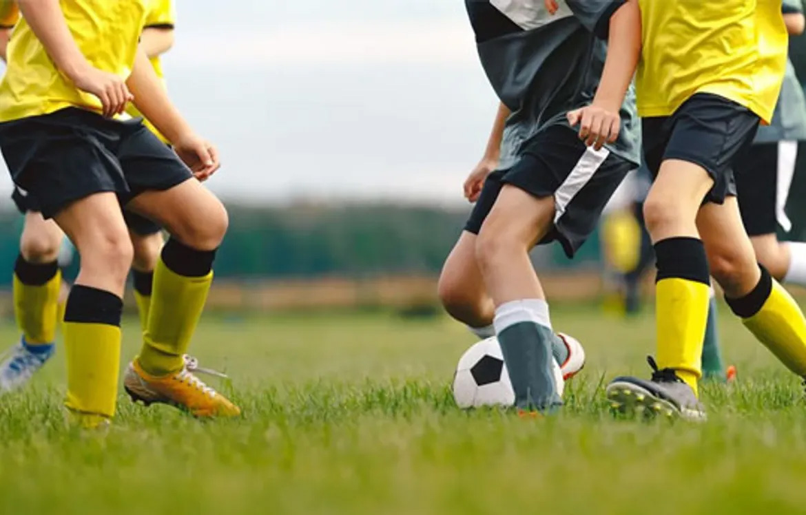 Girls playing football