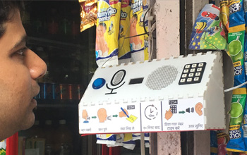 kids interacting with a google speaker