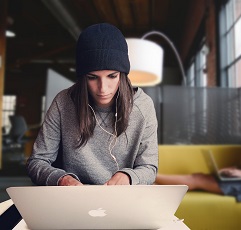 young woman working on a laptop