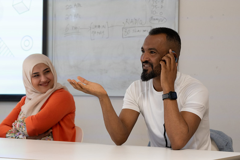 two students on a panel discussion