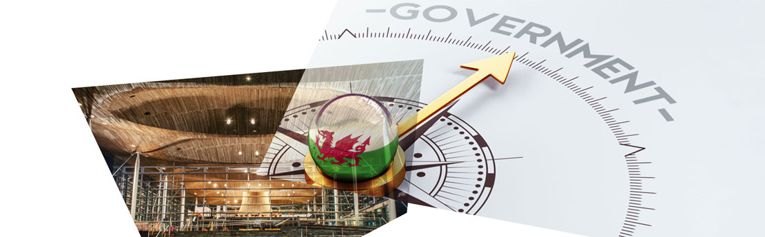 Senedd with Welsh flag over laid