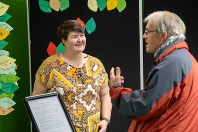 two colleagues talking at festival