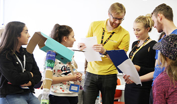 Luke Clements and Casey Hopkins talking with technocamps staff