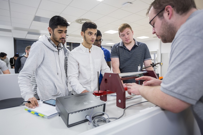 Students working with a lecturer 