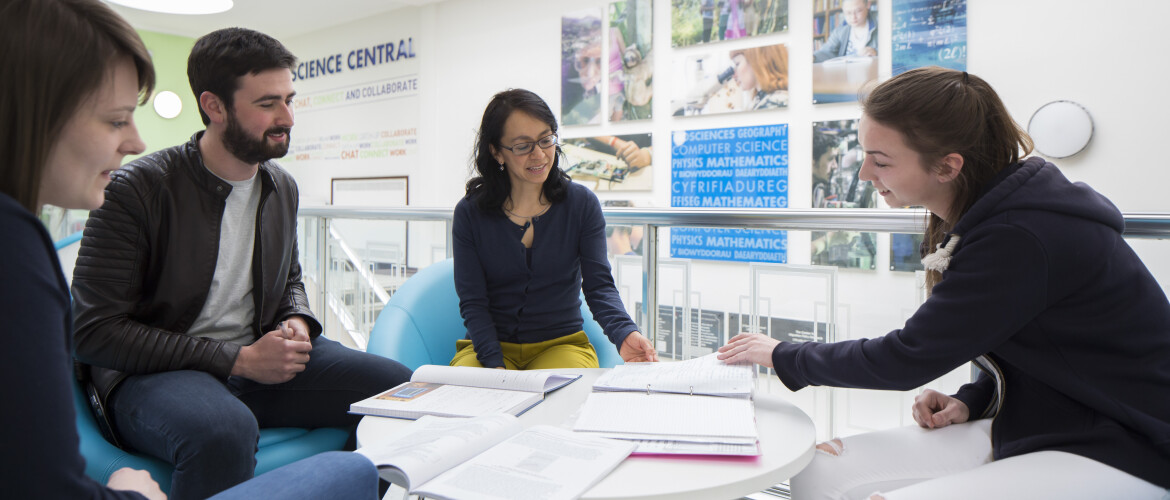 Academic staff discussing issue around a table