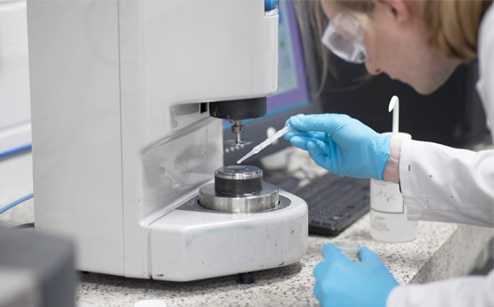 Researcher with a microscope