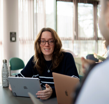 Woman sitting in front of a laptop