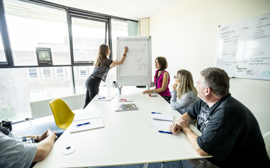 Researchers presenting in a room