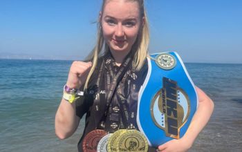 Sport Scholar, Charley Davies, with her four medals and winning belt 