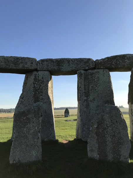 The Friar's Heel stone seen through the megalithic portals of Stonehenge