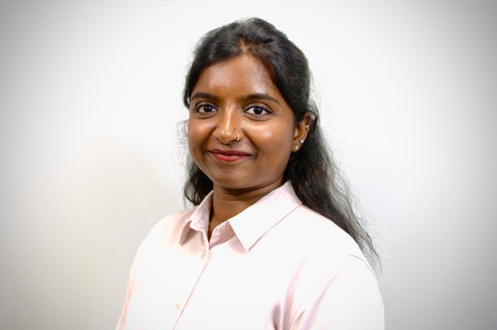 A headshot photograph of Sarika on a white background