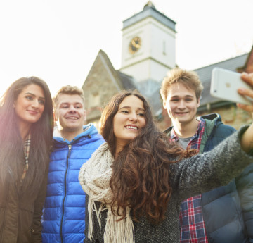 'Student Vlogs' with image of four students in the background