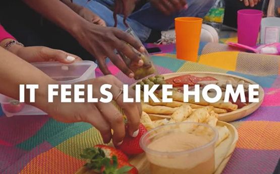 Picnic on the beach with the words 'it feels like home'