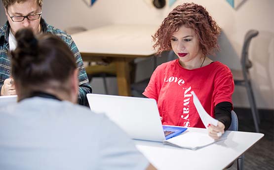 A female student working on a laptop