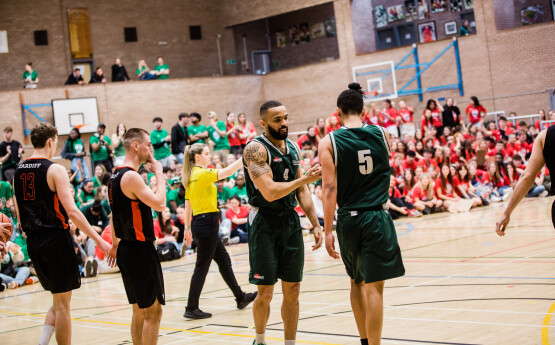 Welsh varsity basketball, players shaking hands