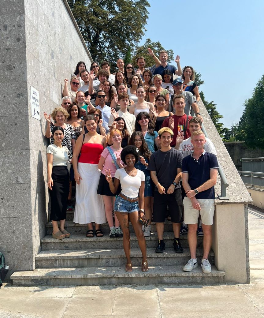 Students standing on steps for group photo.