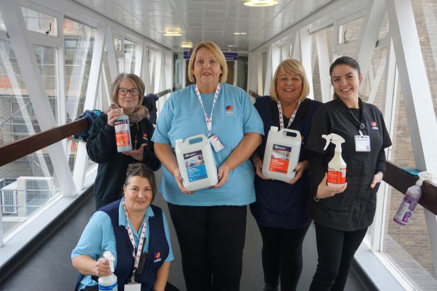 5 members of staff from the Cleaning team holding BioHygiene cleaning products 