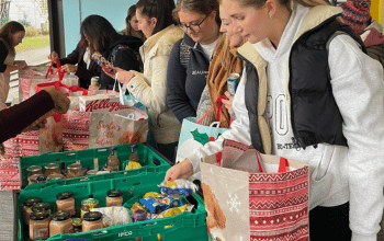 Students at the community fridge choosing their food items