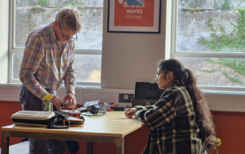 An electronic repair being made at the Repair Café on campus 