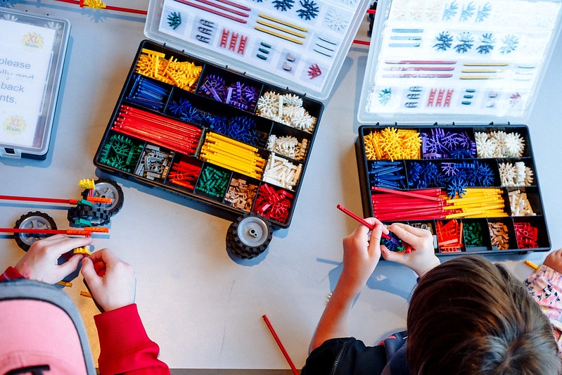 Children playing with colour bricks