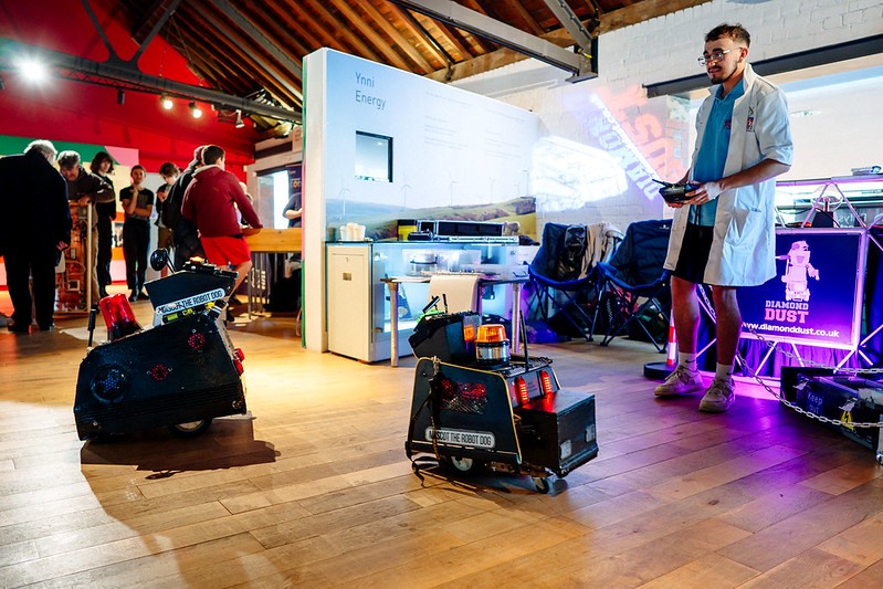 Man controlling robots